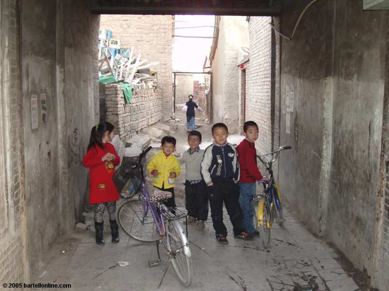 Children in alley in old section of Hohhot, Inner Mongolia, China