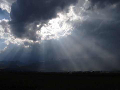 Sunrays illuminating Aragats-Aparan village, Armenia with Mt. Aragats in the distant background
