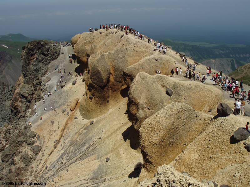 Tourists on the summit of Tianwen Peak in the Changbaishan Nature Preserve in Jilin, China