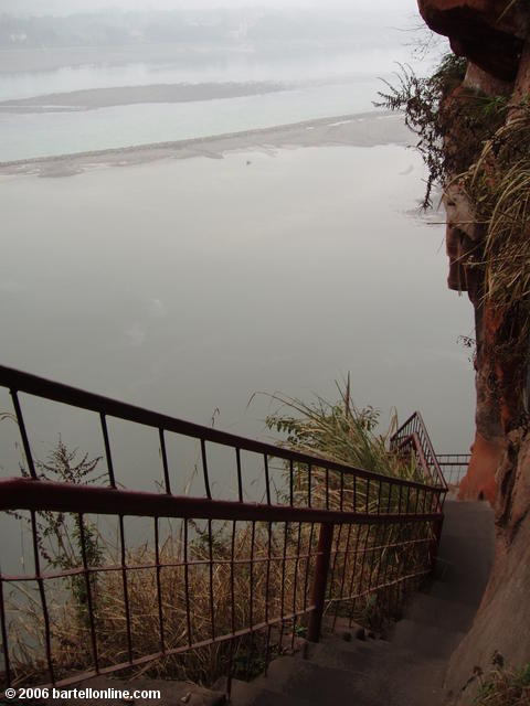 Narrow stairs wind down the cliff beside the Giant Buddha in Leshan, Sichuan, China
