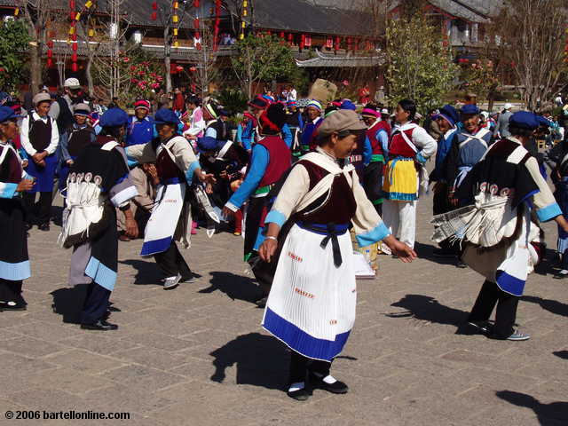 Dancers in minority costumes seen in the Old Town section of Lijiang, Yunnan, China