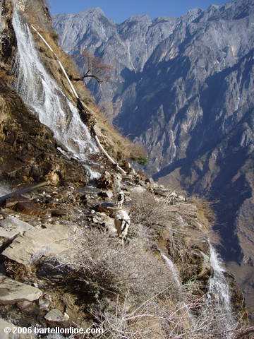 A waterfall partially washes out a section of the upper trail through Tiger Leaping Gorge in Yunnan, China
