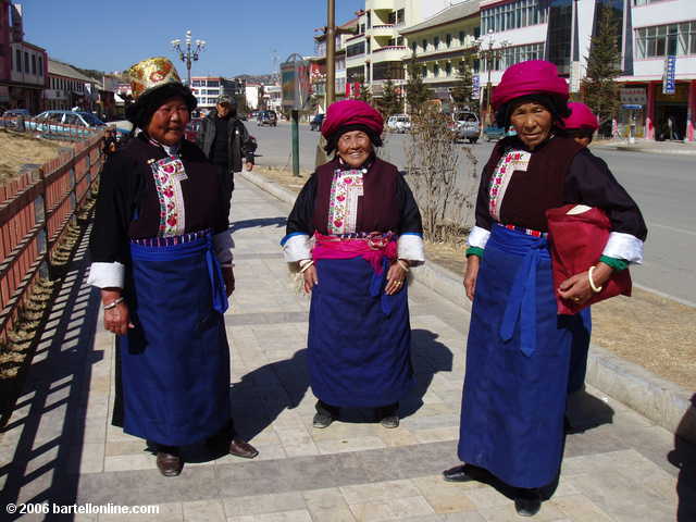 Women in local minority garb on a street in Zhongdian ("Shangri-La"), Yunnan, China